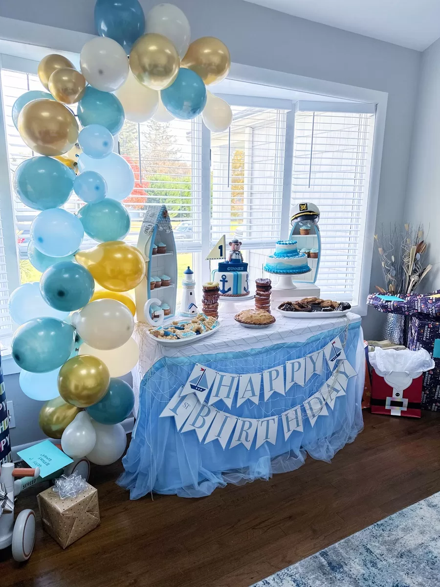 gold and blue party balloon arch