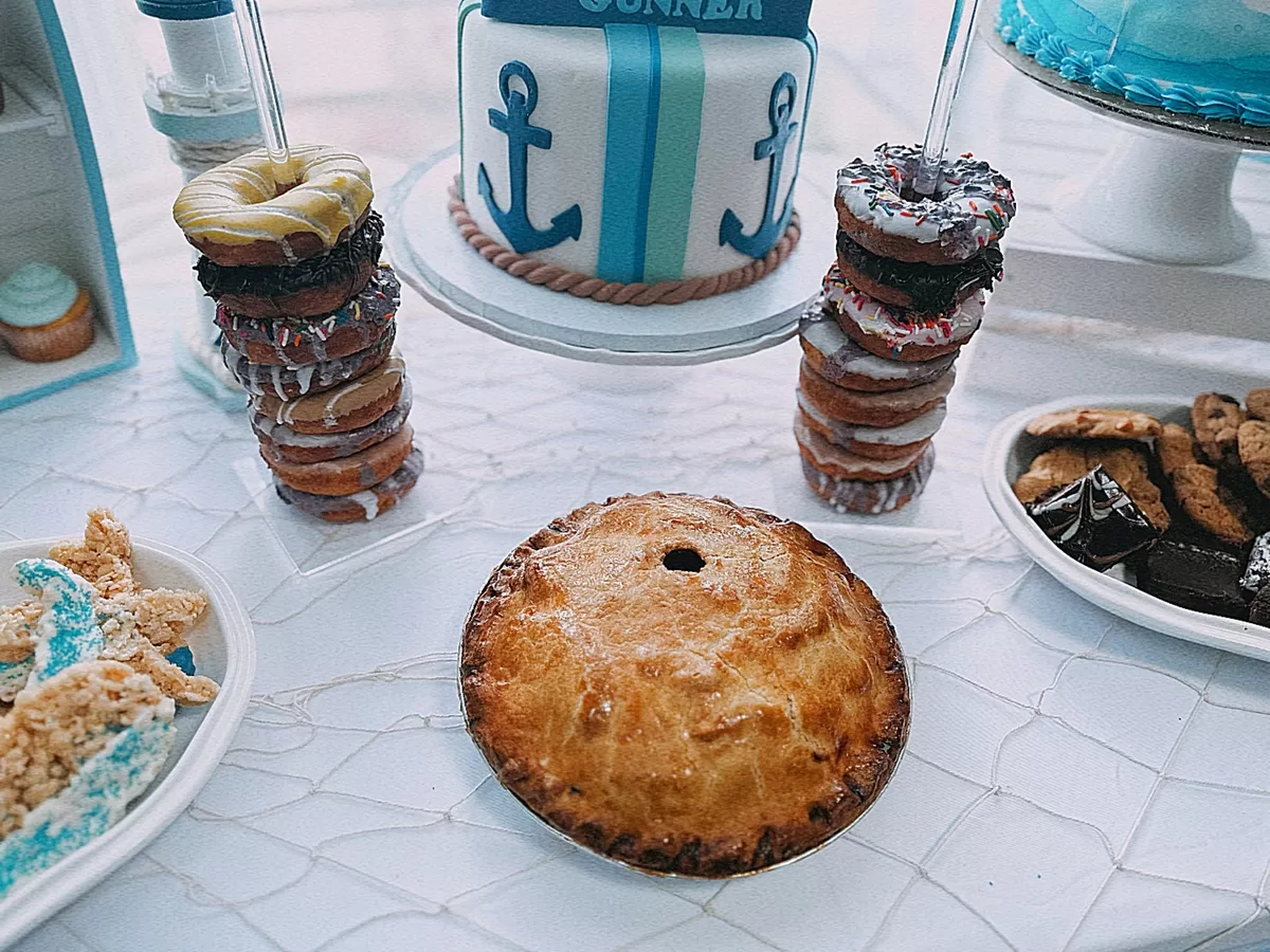 apple pie and donuts on a rack