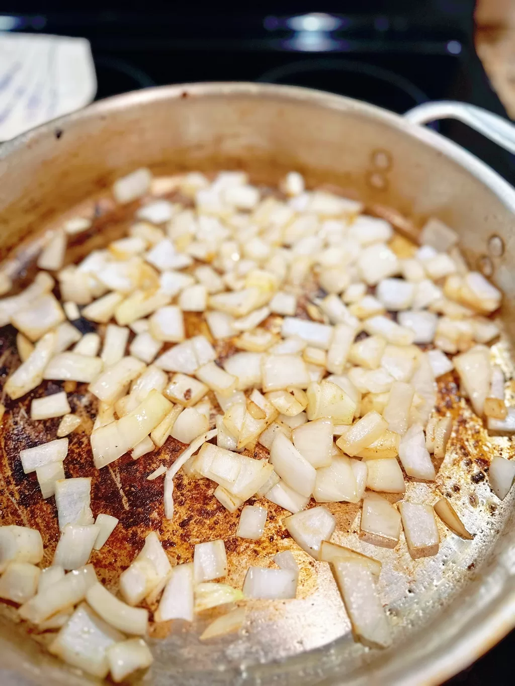 chopped onions browning in a pan