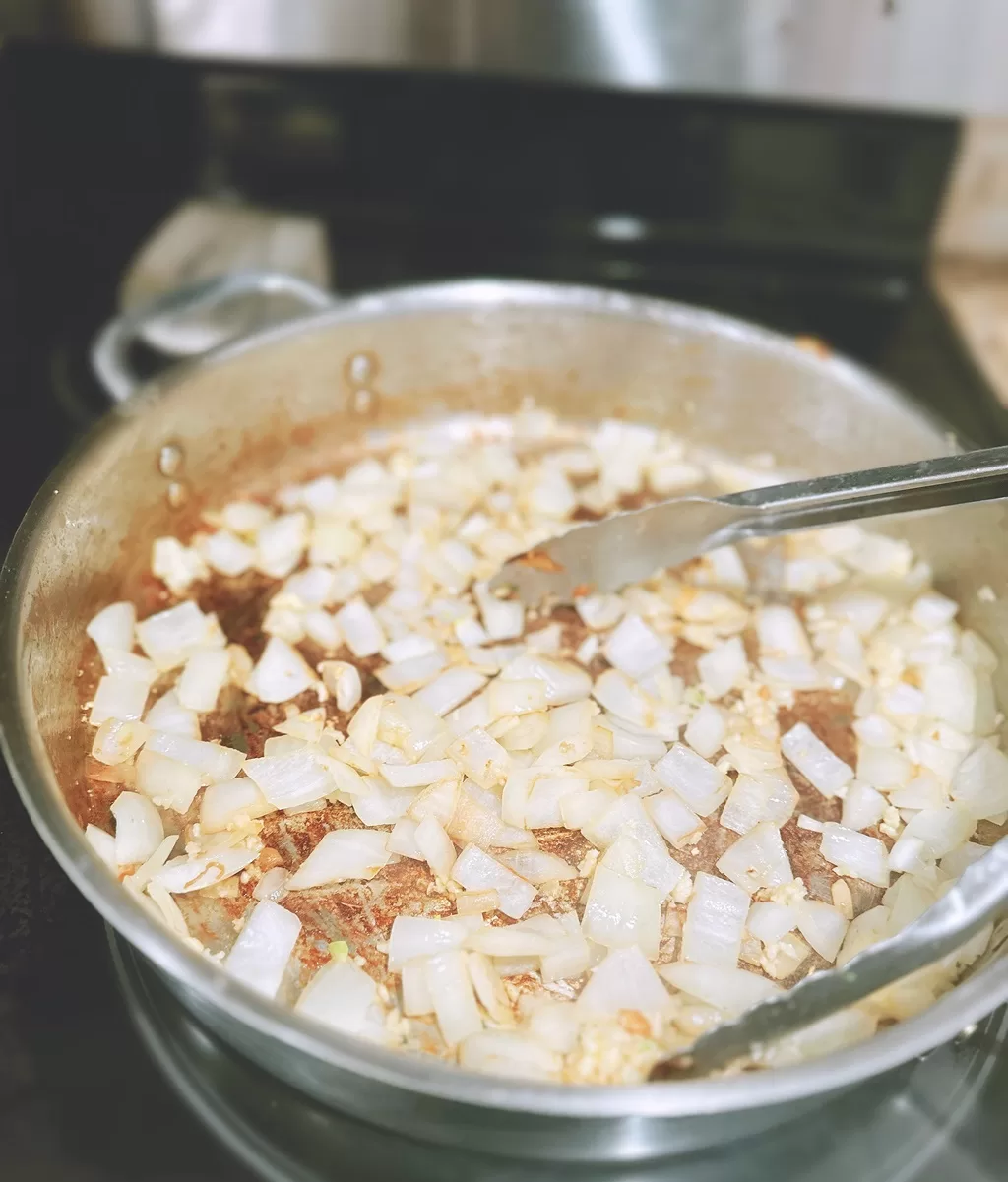 onions cooking in a pan