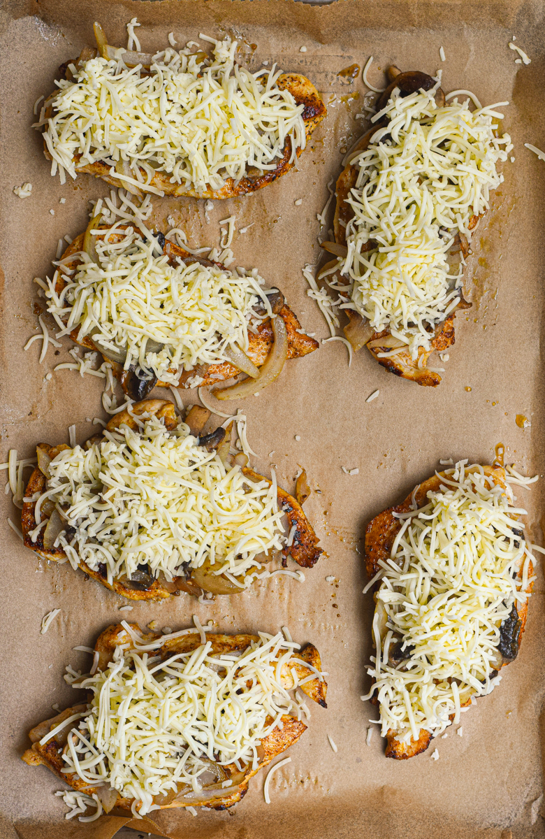 texas roadhouse smothered chicken sitting on a baking tray