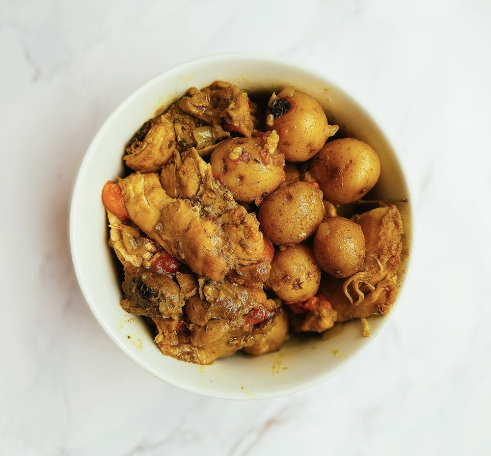 jamaican curry chicken in a white bowl