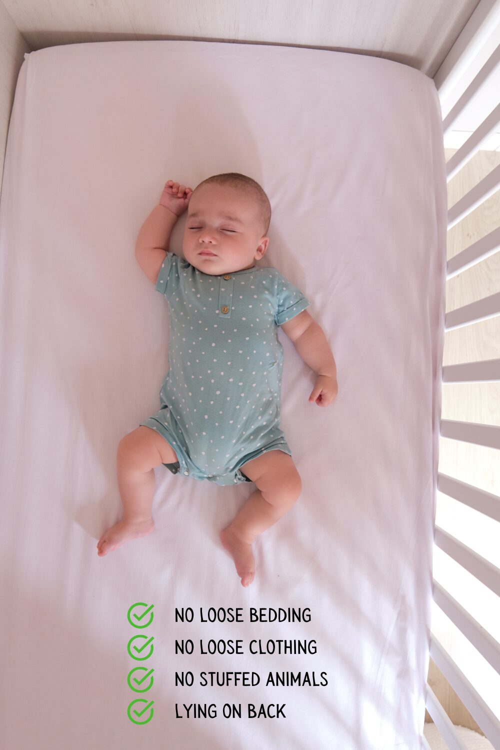 photo of baby sleeping with no blankets, alone in a crib with no stuffed animals on her back