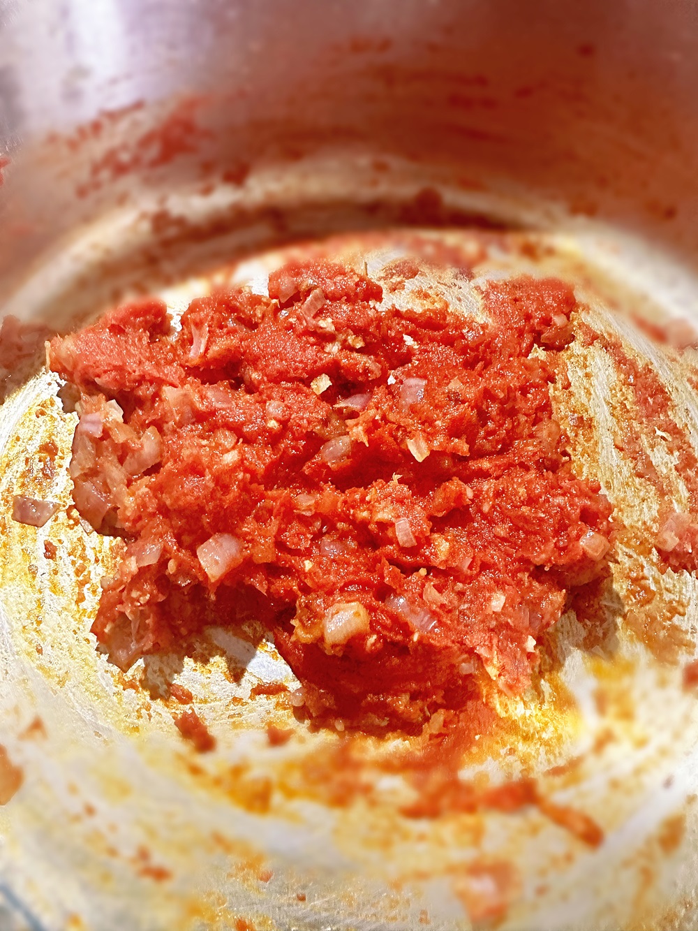 tomato paste sauté in a pan