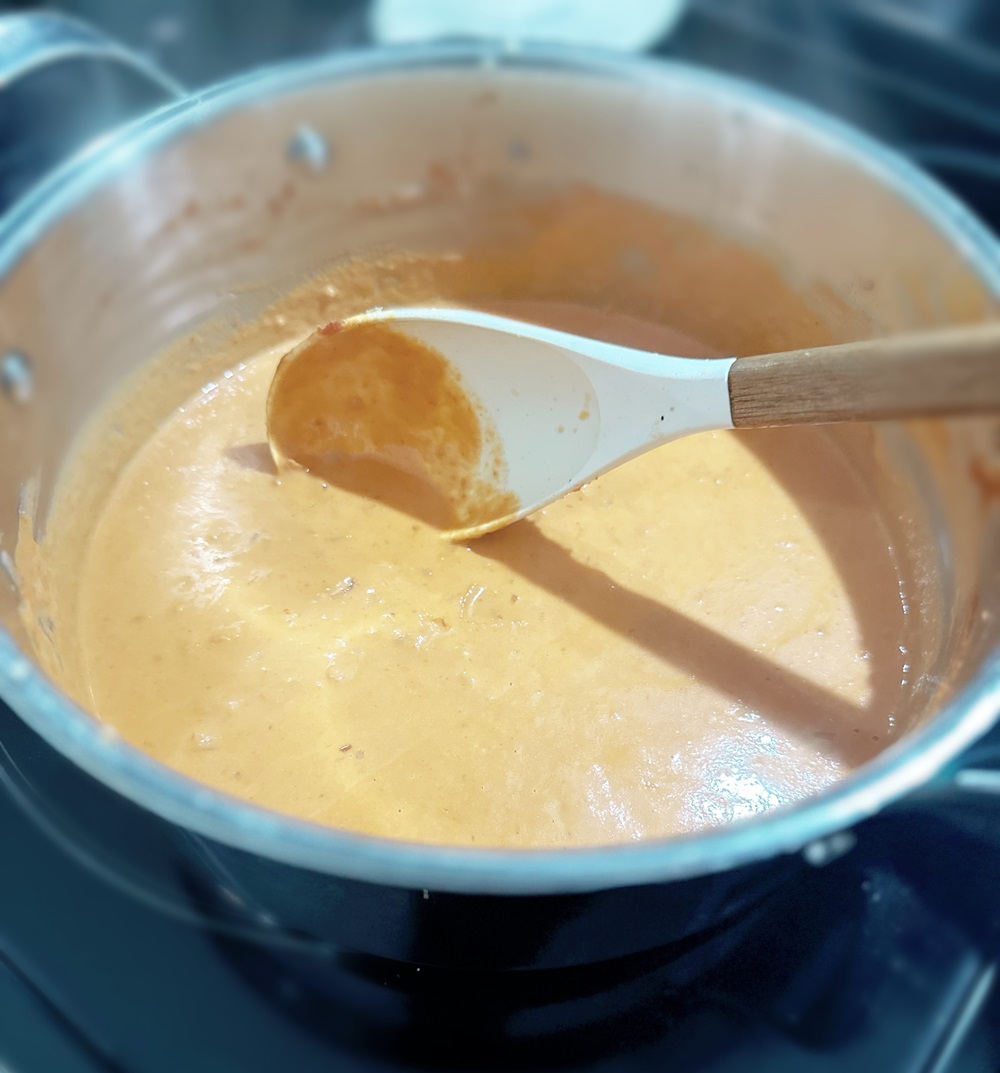 ravioli sauce simmering in a pot