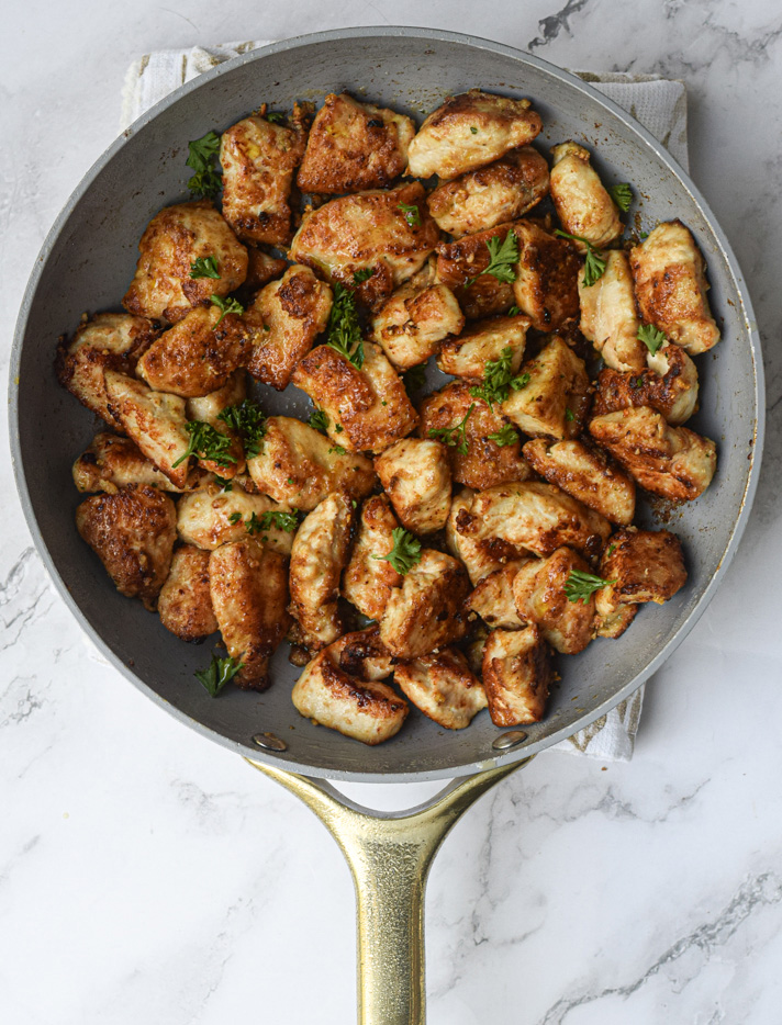 Garlic Butter Chicken Bites in a white frying pan