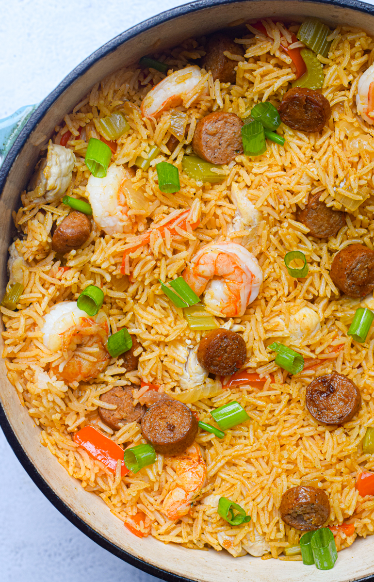 closeup of cajun jambalaya in a blue dutch oven