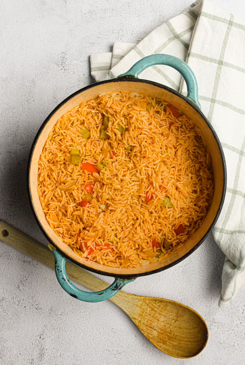 rice and vegetables in a blue dutch oven