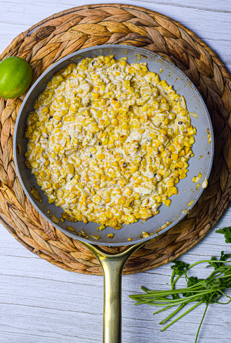 elote in a white frying pan