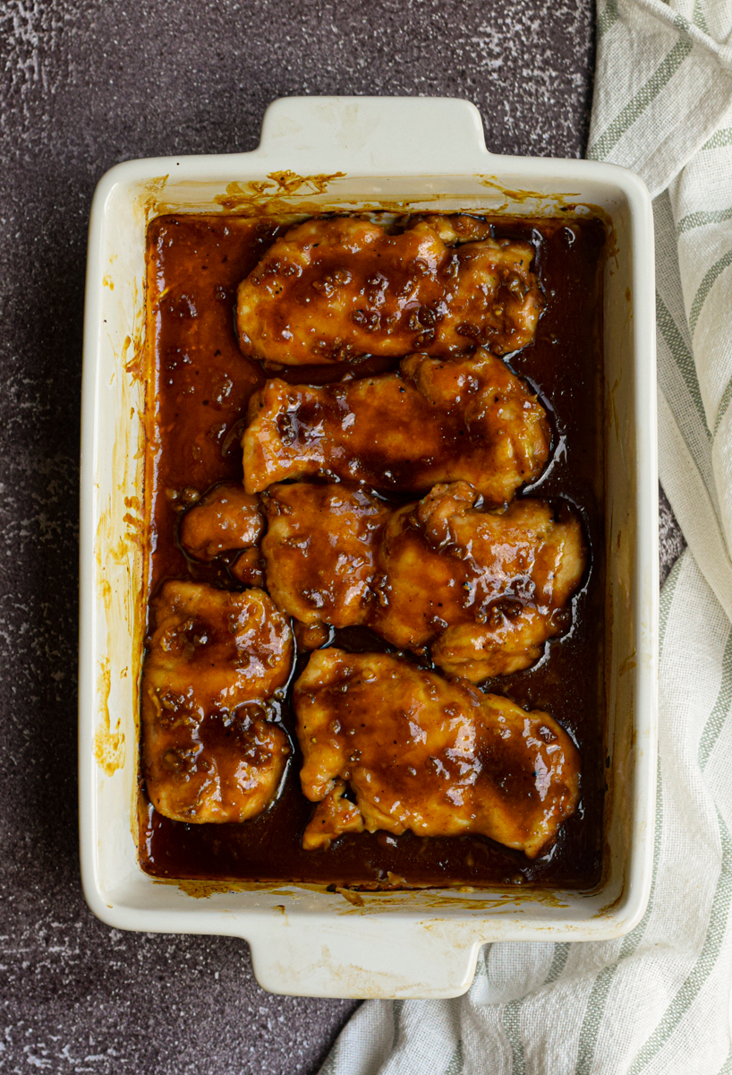 honey garlic chicken sitting in a white baking dish