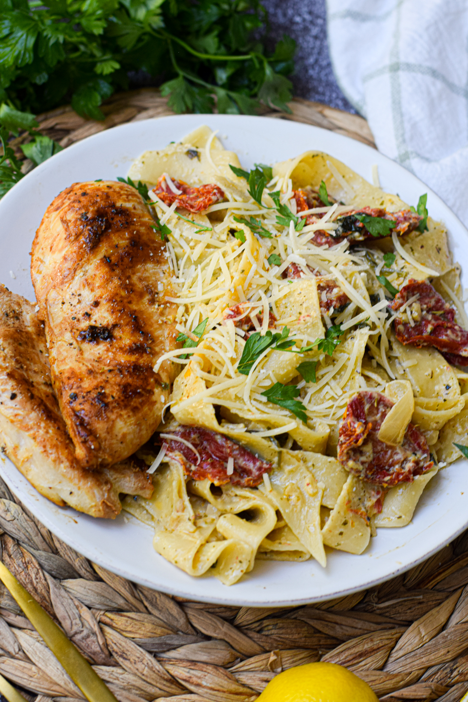creamy tomato pesto pasta on a white dinner plate