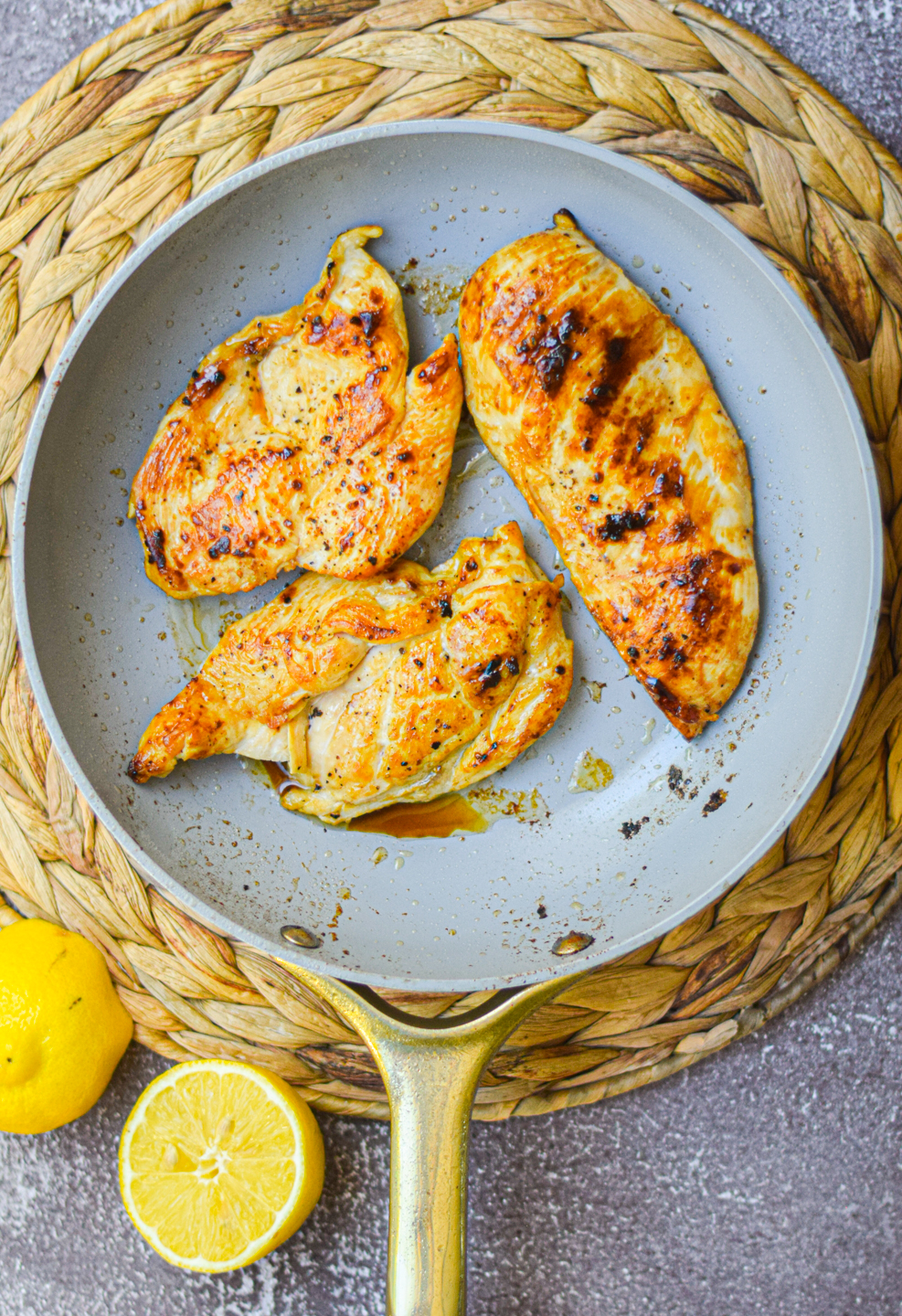 grilled chicken sitting in a frying pan