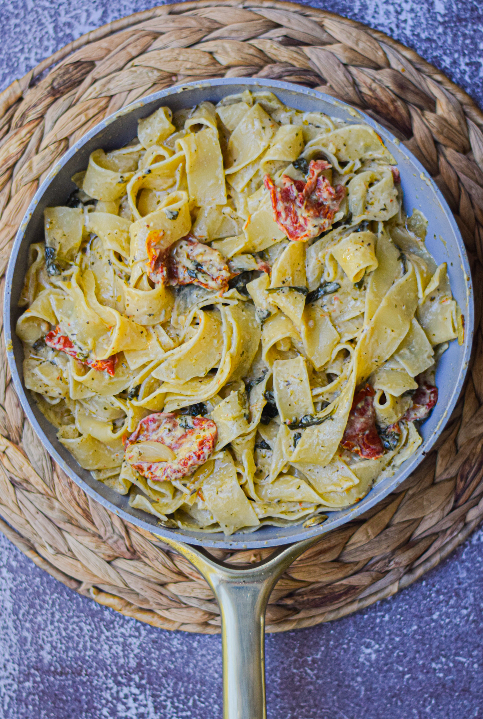 creamy tomato pesto pasta in a pan