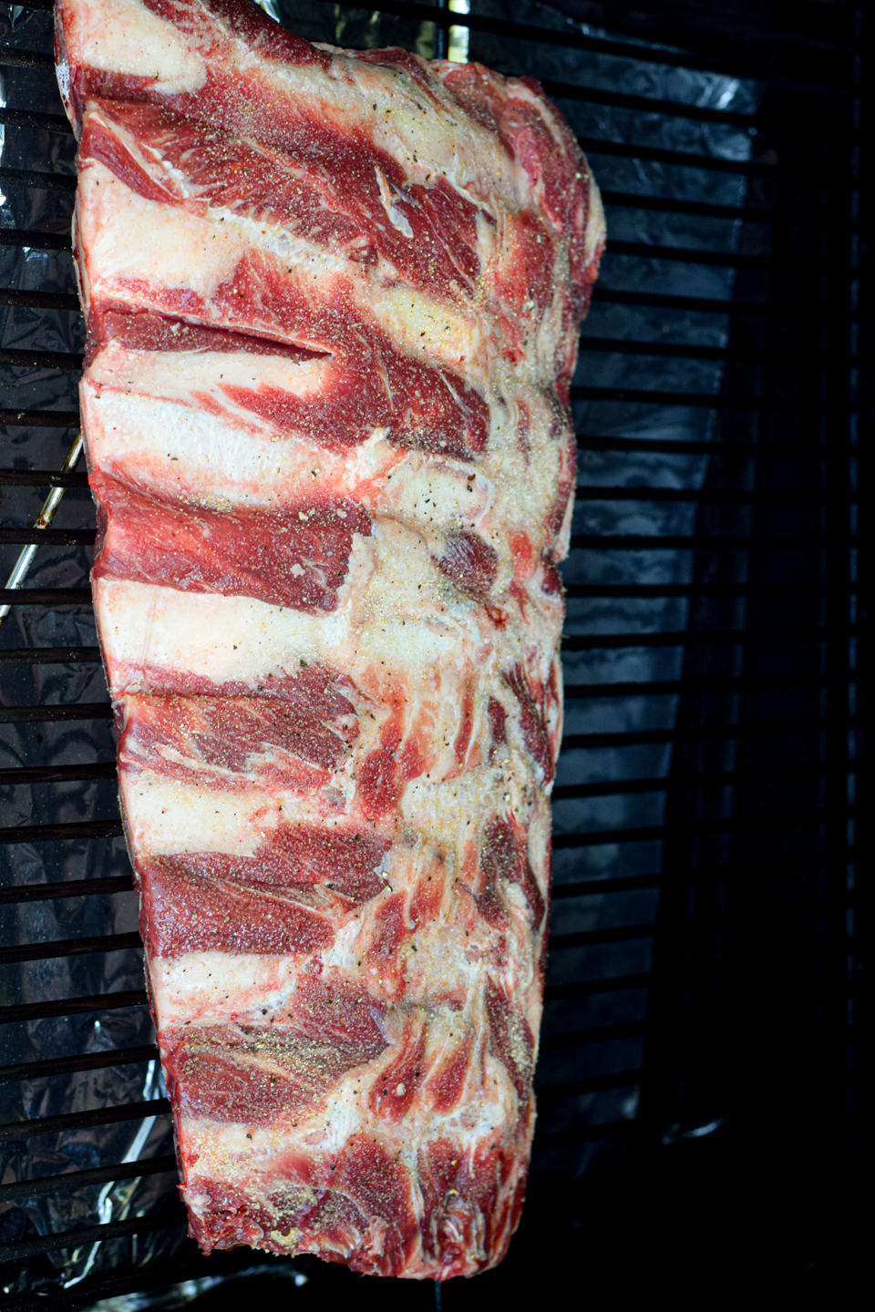 raw beef back ribs on the smoker