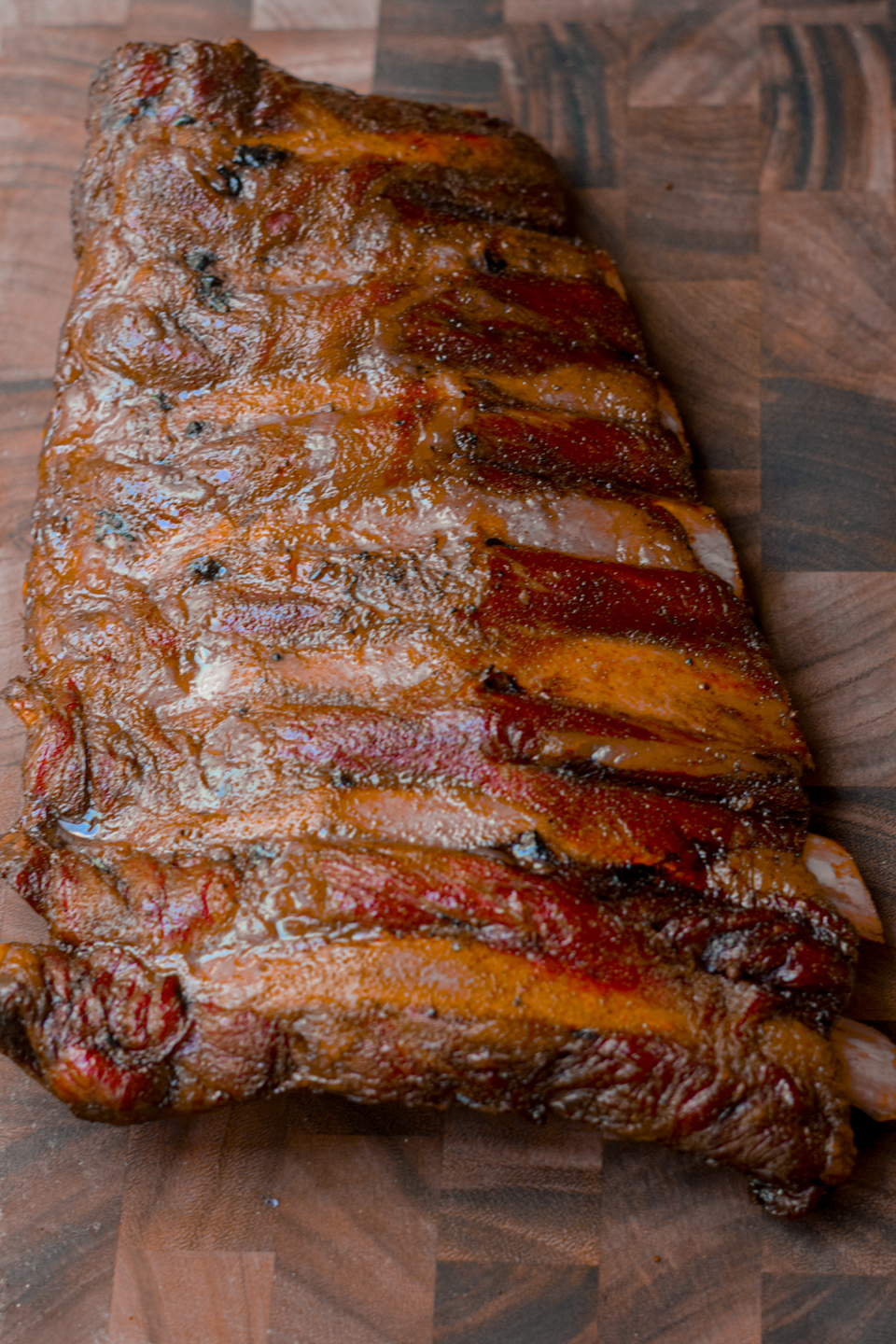 smoked beef back ribs on a wooden cutting board