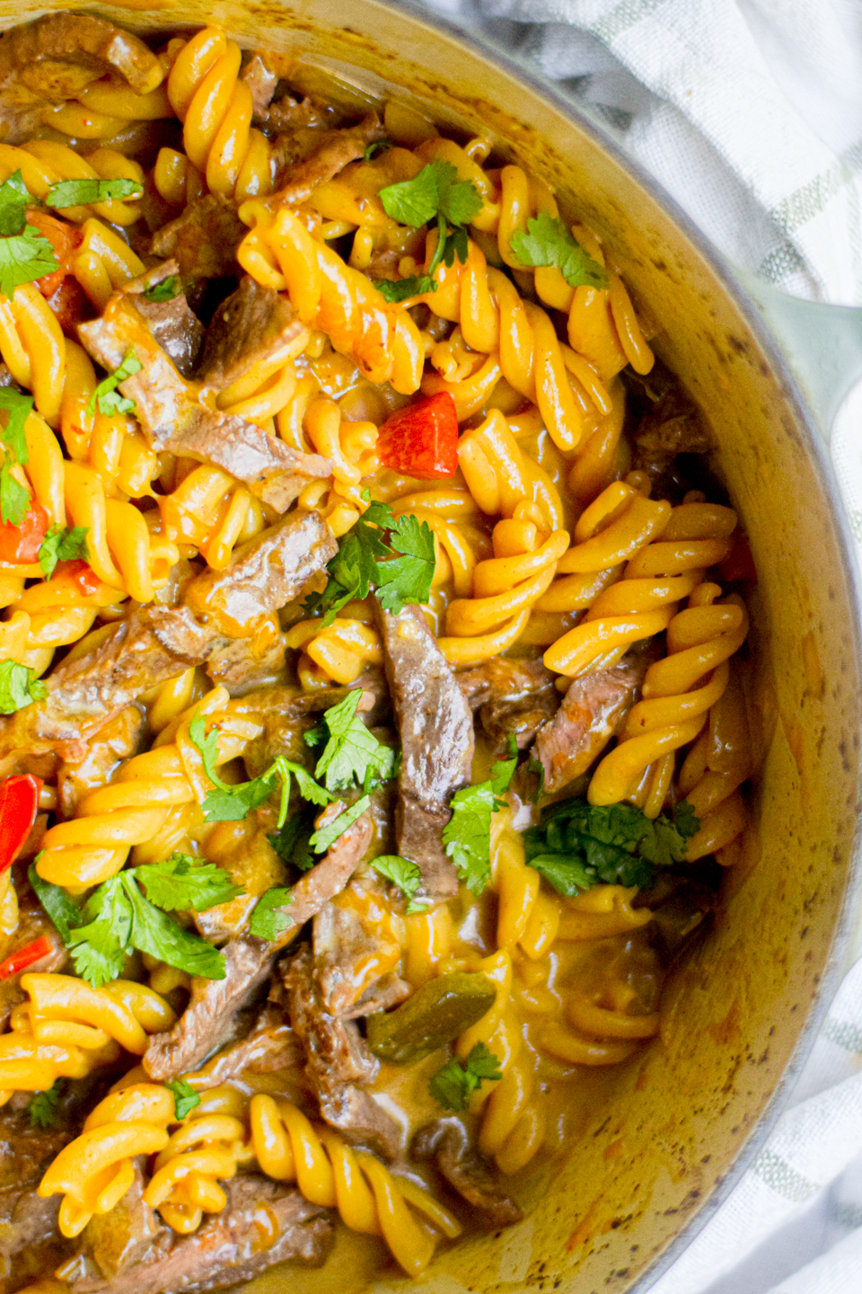 philly cheesesteak pasta closeup in a dutch oven