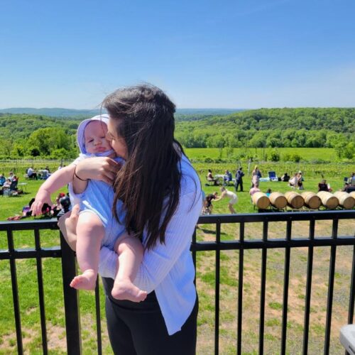 photo of briana with the New Hampshire white mountains in the background