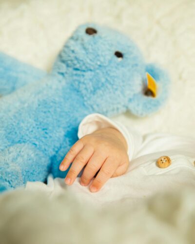 baby sleeping with teddy bear