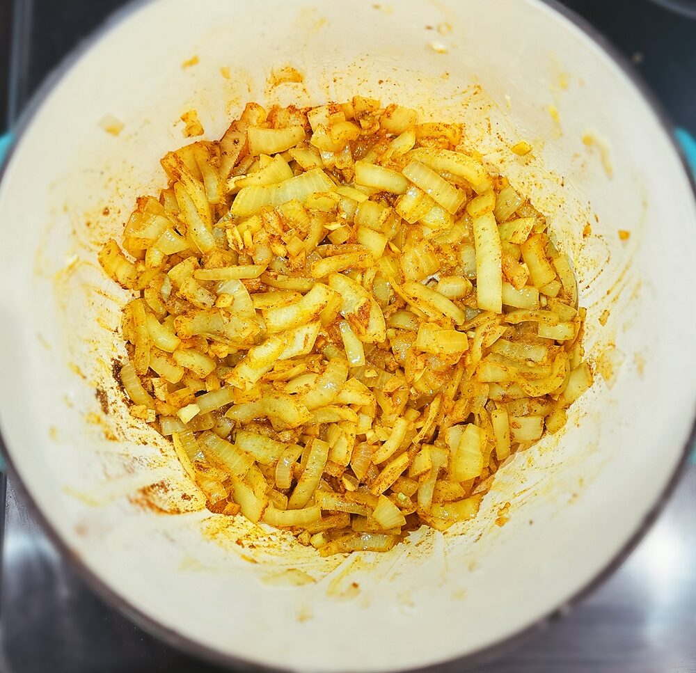 onions seasoned in curry cooking in oil