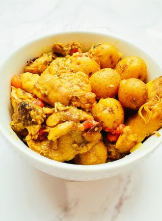 jamaican curry chicken in a white bowl