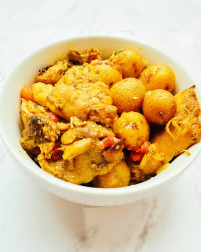 jamaican curry chicken in a white bowl