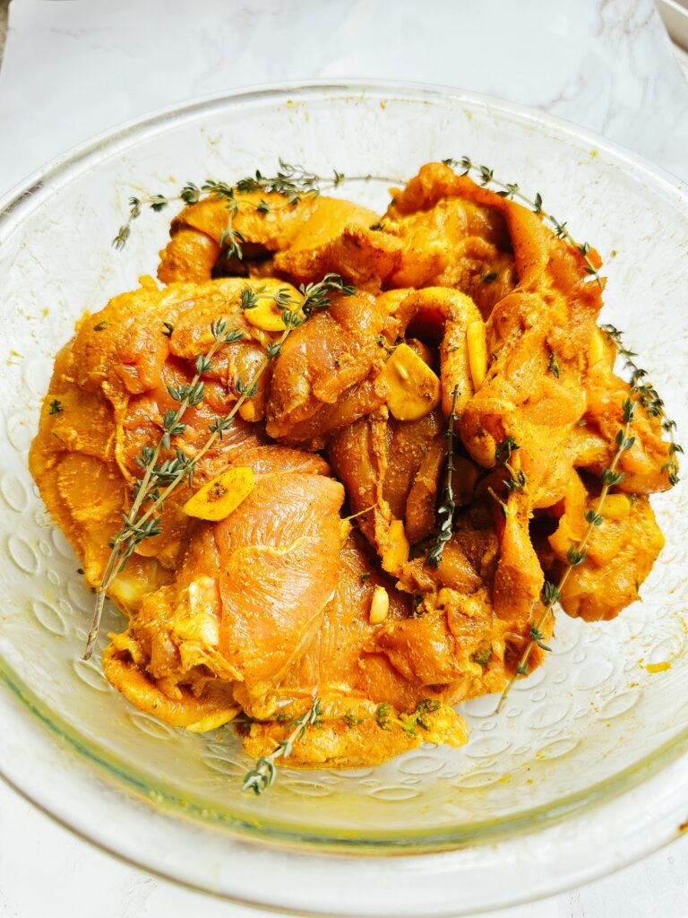 jamaican chicken curry in a bowl marinating