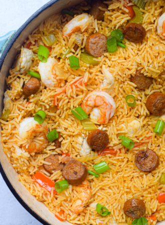 closeup of cajun jambalaya in a blue dutch oven