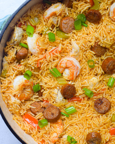 closeup of cajun jambalaya in a blue dutch oven