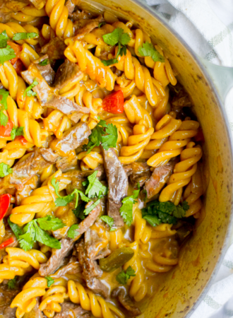 philly cheesesteak pasta closeup in a dutch oven