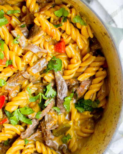 philly cheesesteak pasta closeup in a dutch oven